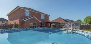 Image of Spacious 5BR Home | Pool, Game Room & Grill
