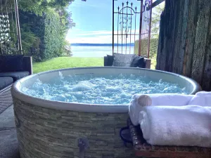 Image of Stunning Water, Sunset and Sound View Getaway Suite with hot tub and firepit