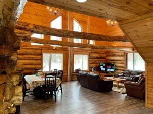 Image of Log home surrounded by woods near Upper South Long Lake