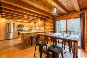 Image of Unique Vermont Log Cabin Nestled in Red Mountains