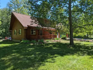 Image of Log Cabin home on the Sturgeon River in Indian River