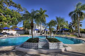 Image of Upstairs unit w Pool view, enclosed porch & workspace