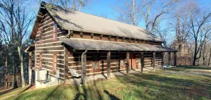 Image of Walk to the water log cabin, access to dock, hot tub, fire pit, grill, spacious