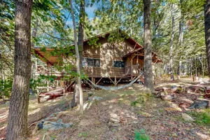 Image of Stunning log cabin with fireplace & nature views - near shopping & dining