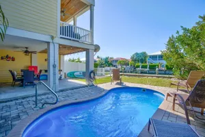 Image of Casa De Tiki 4bed\/3bath half duplex w\/ heated pool, dockage & more!