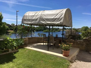 Image of Glorious riverside town apartment with private garden overlooking La Dordogne .