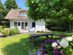Image of Charming reed roof Lakehouse, with surrounded garden, trampoline and watersports option