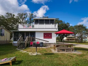Image of Waterfront Cabin On Bastrop Bayou With A Lighted Fishing Pier