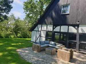 Image of Romantic thatched-roof house with wellness area near the dyke