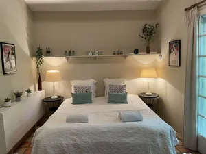 Image of A beautiful romantic bedroom with a mezzanine area, bathroom and private garden