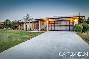 Image of Beautiful 3 bedroom 2.5 bath with heated pool! New pool cage, A\/C unit.