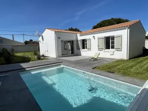 Image of Detached house closed by walls near the sea.