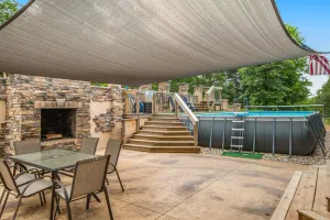 Image of Two-story, dog-friendly home with a pool, indoor\/outdoor fireplaces, & AC