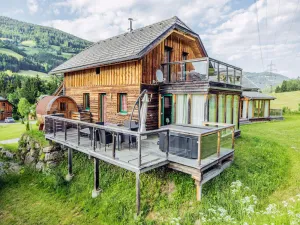 Image of Alpine house with a unique barrel sauna