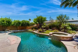 Image of Oasis-style, dog-friendly home w\/ a furnished patio, yard, private pool, & spa
