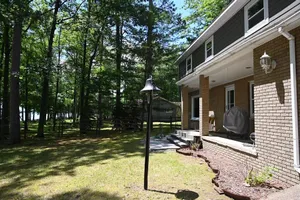 Image of Spacious vacation home on large private wooded lot on crystal clear Hubbard Lake