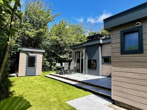 Image of Beautiful, brand new and uniquely designed chalet with pretty garden. Very spacious, modernly furnished for 5 people with luxurious \"infinity\" gas fireplace, wash-and-dryer and free WiFi.