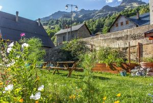 Image of A rustic, stonewalled property with open living room & cosy log fire