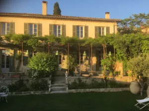Image of Lourmarin facing the castle, old bastide, garden and pool