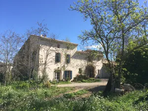 Image of Character building on large wooded grounds with private garden.