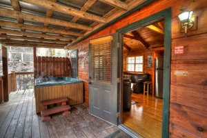 Image of Old Creek: Picturesque Cabin with a Deck Overlooking a Beautiful Stream in The Great Smoky Mountains