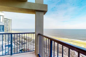Image of Two-story penthouse condo with spacious balcony, pool, & incredible views