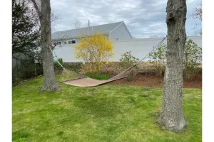 Image of Feet in sand, then return to yard, hammock, deck, outdoor shower, bbq, fire pit!