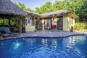 Image of Quaint Pool House in Tropical Setting