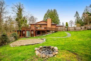 Image of Quiet & secluded getaway with backyard, firepit, wraparound deck & wood stove