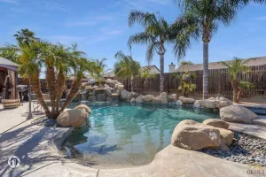 Image of Enjoy a Mini Oasis w\/ Pool Waterfall 4bd\/2ba Home!