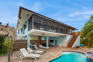 Image of Waterfront house with covered patio, private pool, & 75' dock - dogs welcome