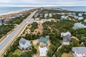 Image of Well-appointed home near the ocean with gas grill, shared outdoor pool, and AC