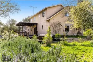 Image of Stunning home with lush garden & furnished deck