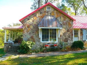 Image of 100 year old stone cottage nestled in beautiful, quiet nature