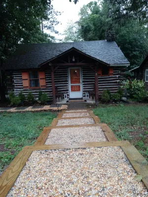Image of Original Chestnut Log Cabin In A Lake Community