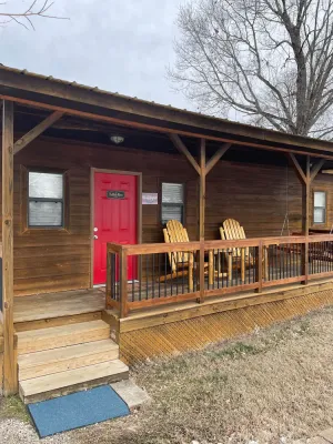 Image of Buffalo River Cabin has 1 bedroom with queen size bed, 1 twin bunk bed in hallway, 1 futon in main l