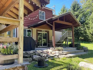 Image of Hot tub, Lake on site, rowboat, kayaks, firepit, grill and more, pet friendly.