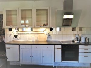 Image of Spacious vacation apartment with fireplace and barrel sauna in the sheltered garden.