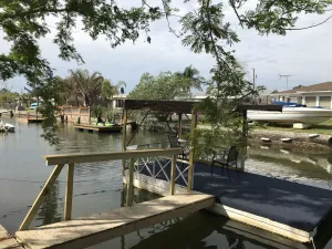 Image of Hudson Beach Waterfront House with dock and canoe