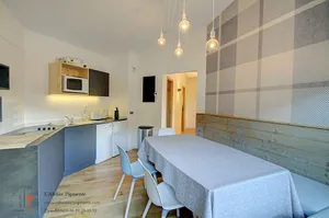 Image of Comfortable and bright family apartment with skis on your feet