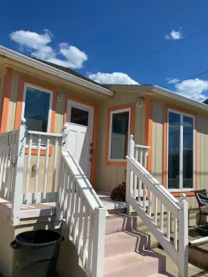 Image of beach house steps to beach and Jenk's Boardwalk