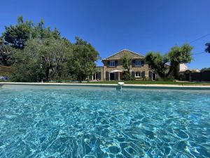 Image of Character house with pool and pool house fenced garden