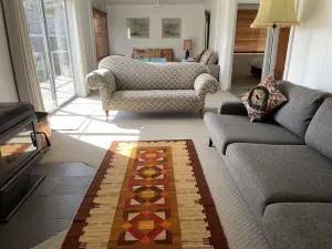 Image of Stylish spacious vintage house, wood fire, 40m to beach inside a National Park