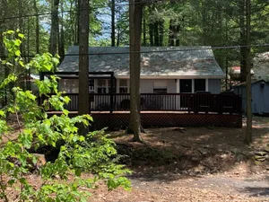 Image of Enjoy being serenaded by loons at this rustic Northwood lake view cottage!