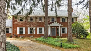Image of Colonial style 5BR\/5BA home tucked in a private, wooded setting w\/pool & hot tub