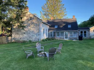 Image of Historic stone farmhouse with rail trail and river access
