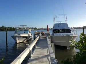 Image of Cottage on the Bay with Sailboat Dock