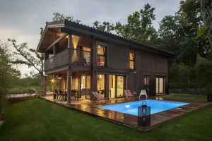 Image of \"Lia\":  Bioclimatic architect's house in solid wood with swimming pool