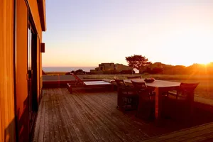 Image of Sunsets over the ocean, waves, whales, serenity, luxury on the bluff