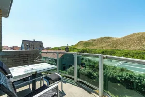 Image of Elegant Apartment With Balcony